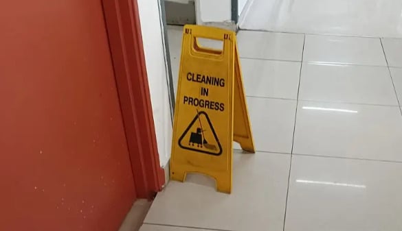 Slip and Fall Settlements Without Surgery with signage